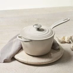 Le Creuset 2.25 Qt. Signature Enameled Cast Iron Saucepan With Stainless Steel Knob | Meringue White 8 Le Creuset 2.25 Qt. Signature Enameled Cast Iron Saucepan With Stainless Steel Knob | Meringue White -Cookware & Knives Shop mer1 1
