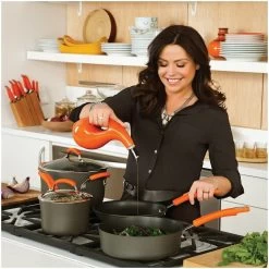 Rachael Ray Hard Anodized II Cookware Set W/ Orange Handles: 10pc -Cookware & Knives Shop rachael ray evoo bottles in use kitchen setting compressed 6 1