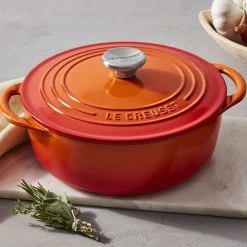 Le Creuset 2.75 Qt. Shallow Round Dutch Oven | Flame -Cookware & Knives Shop rs18381 221017 lecreuset flameclassicshallowrdo herbs horiz ret